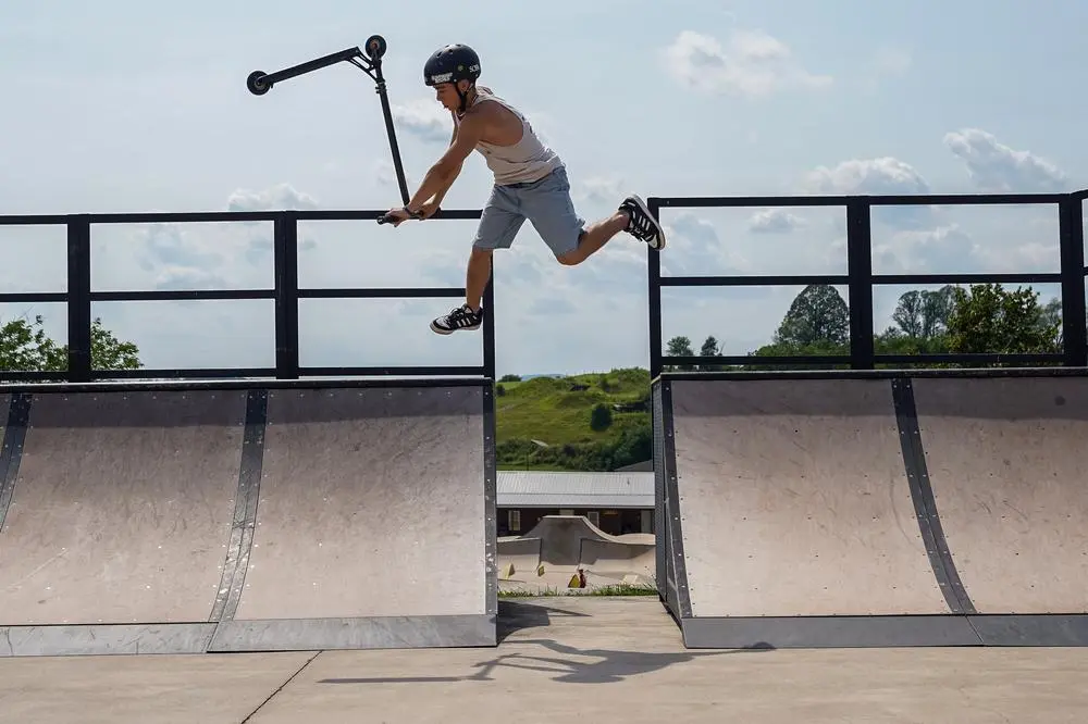 Scooter kid whip on the gap in The Rock