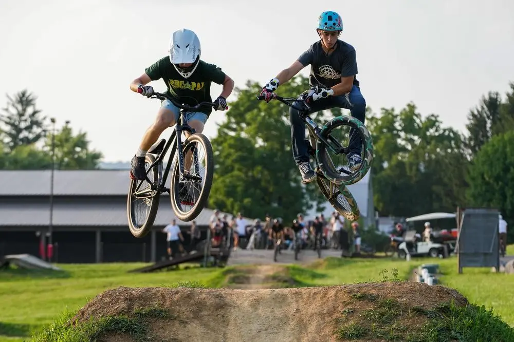 BMX dirt jumpers on small dirt track