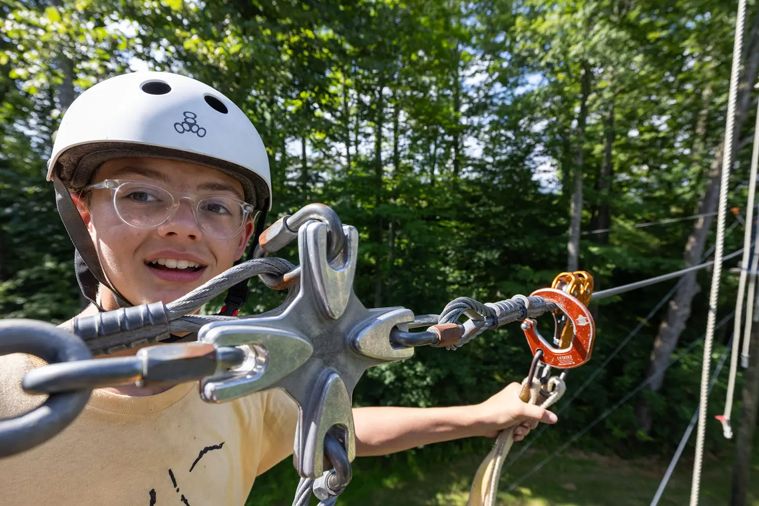 A camper on our high ropes course