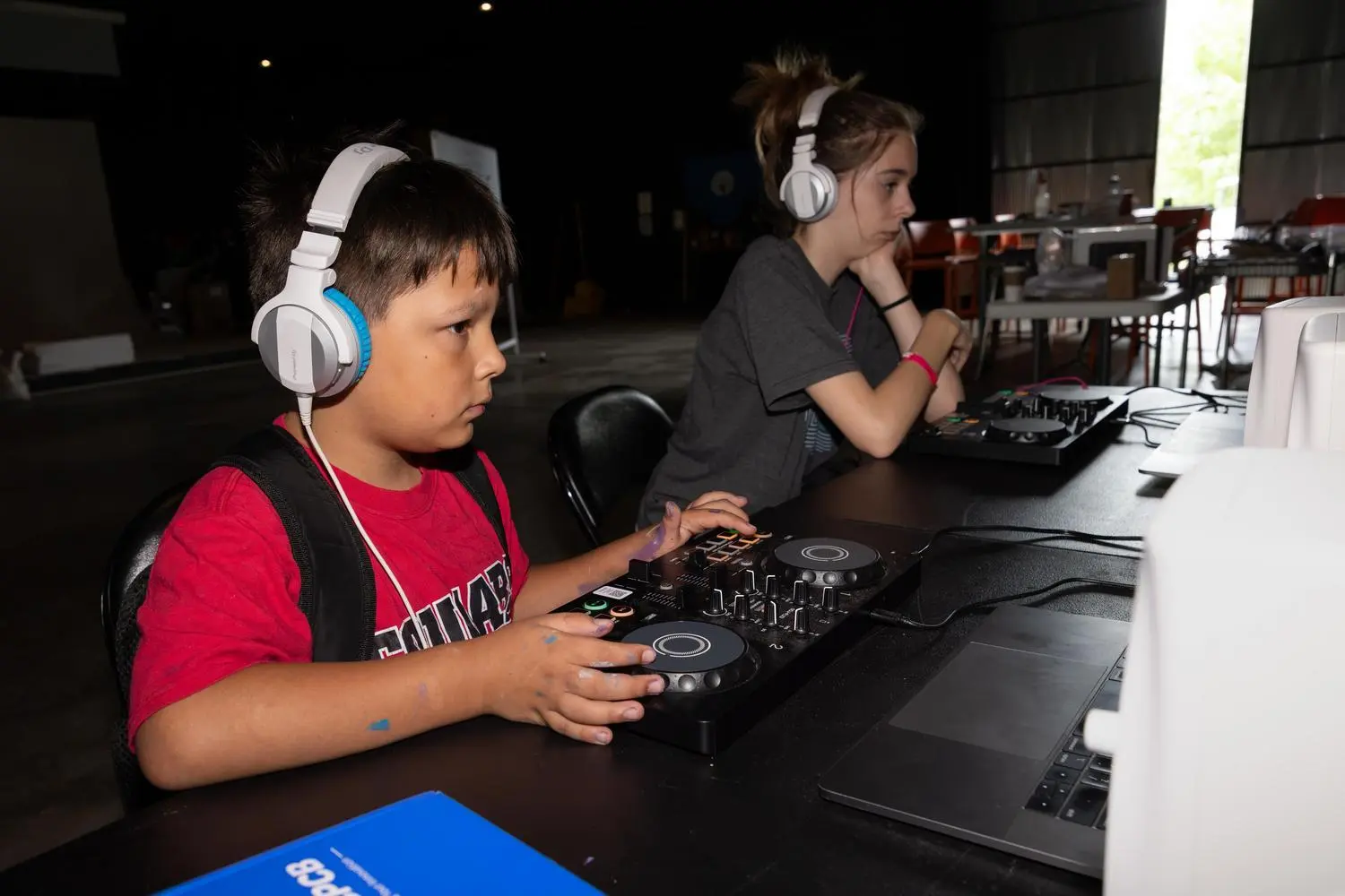 kids working with dj boards